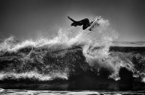 Another flying surfer from the US Open in Huntington Beach. ISO 200, 365mm, f5.6, 1/1250. Processed in Adobe Camera Raw to increase exposure and blacks. Imagenomic Noiseware noise reduction, and black and white conversion using Nik Silver Efex.